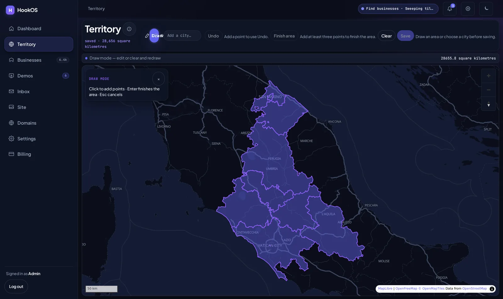 The Territory screen: a dark map of central Italy with a hand-drawn area shaded in violet, showing 28,656 square kilometres saved.